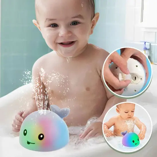 garcon content amuser par jet jouet de bain baleine lumineuse